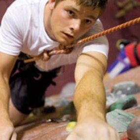 student on climbing wall